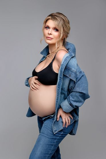 Creative maternity photography in Roseville CA with artistic styling and props