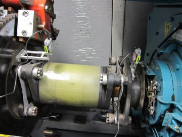 Close-up of a mechanical roller with wires attached.