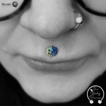 Medusa lip piercing Black and white photo two toned pumpkin stud blue fade colour