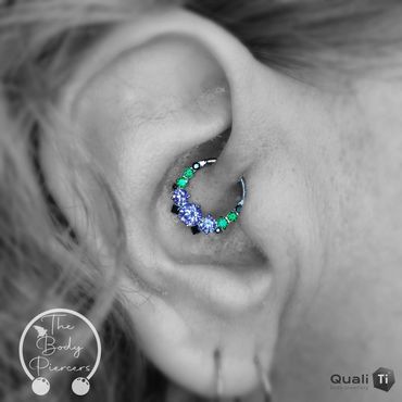 Black and white photo ear piercing green purple hinge ring