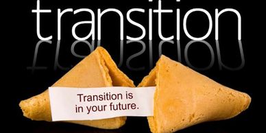 Open fortune cookie on a black background says Transition is in your future. 