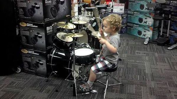 Two year old on drums at Guitar Center!