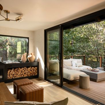Cozy indoor-outdoor living space with natural elements.