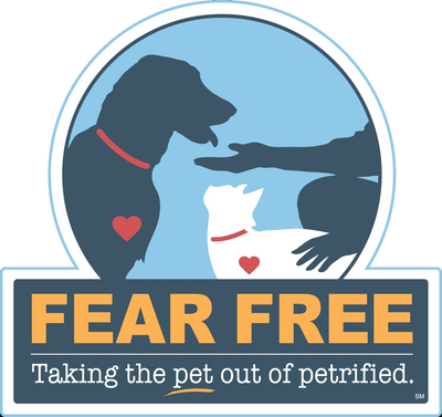 Fear Free logo with a dog, cat, and a caring human hand. Welcome Waggin' Mobile Veterinary Care They're Happy To See!