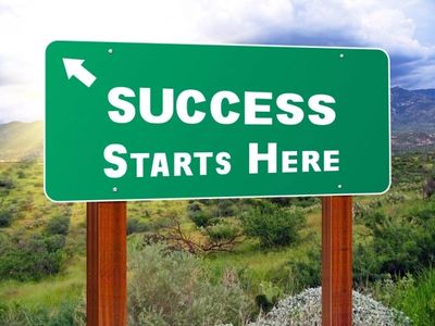 Road sign with message "Success Starts Here."