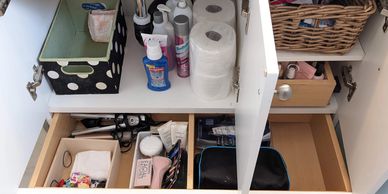 Organized spaces under a bathroom vanity