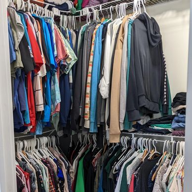 Closet filled with clothes from ceiling to floor