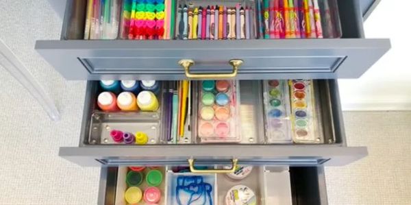 open drawers showing organized kids craft supplies