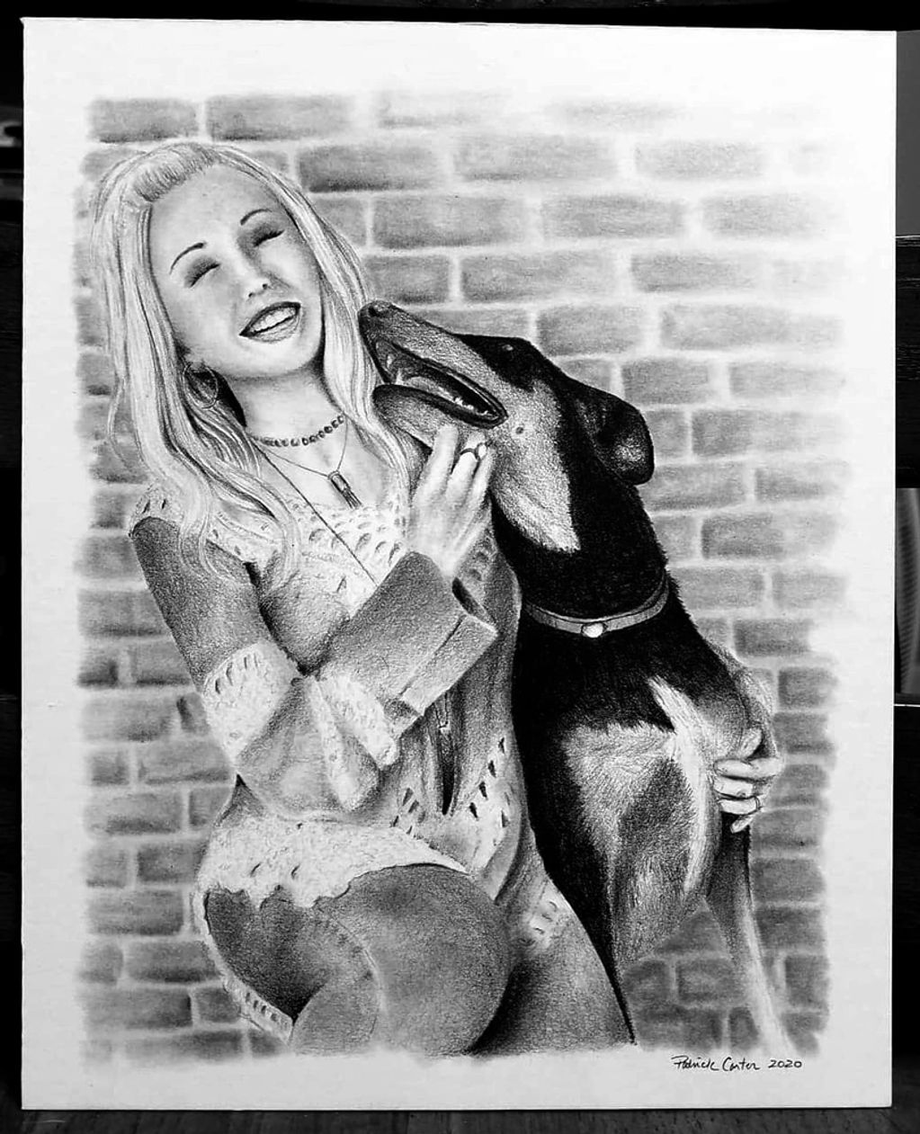 pencil drawing of dog kissing owner in the face