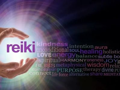 Hands radiating healing energy with Reiki-related words.