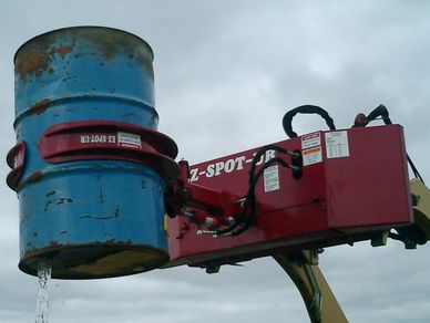 EZ-0002 Barrel Handler on the chain base dumping a barrel.