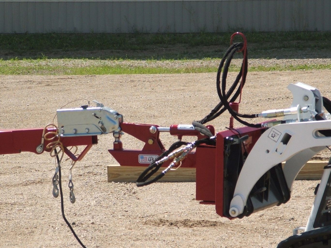 EZ Spot UR EZ-0011 Hitch Tool attachment on a bobcat mt55 mini track loader moving a trailer