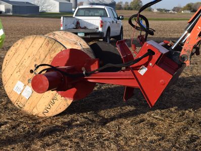 The EZ Spot UR EZ-WR01 Wire Reel attachment loading up a spool for wire.