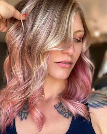 Blonde woman with pink highlights