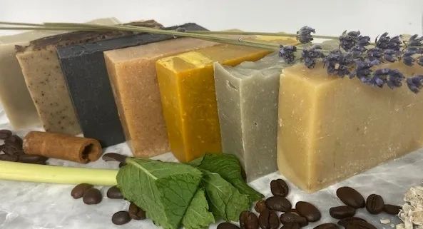 Various handmade soap bars with natural ingredients.