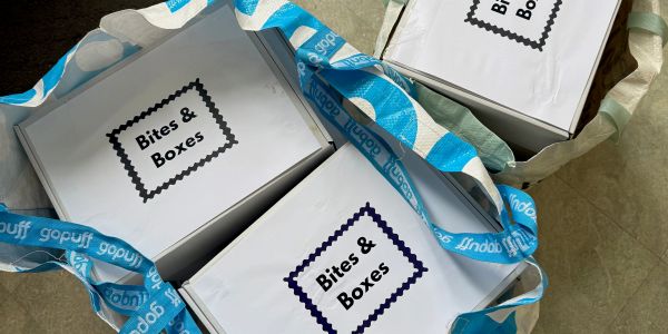 Bites &amp; Boxes takeaway food boxes in a reusable bag.