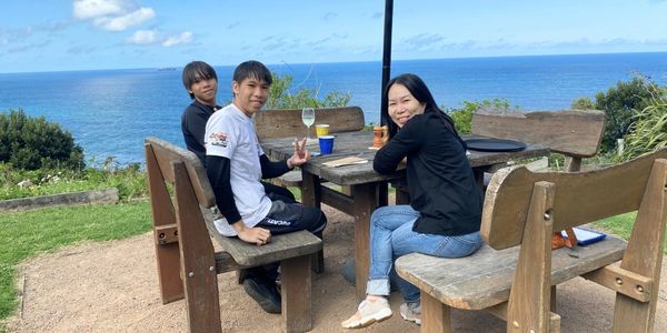 Guests from Singapore enjoying lunch at Scarborough on the NSW South Coast as part of a Kiama & Kang