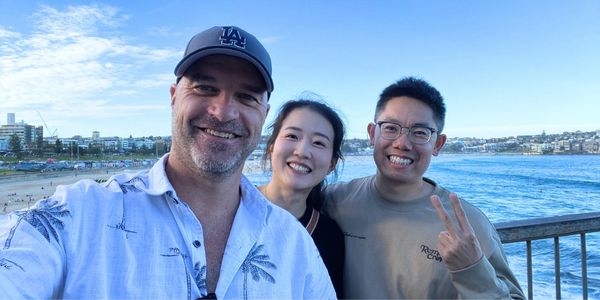 Harbvour City Tours Founder & Managing Director Jack Pellow with guests from China at Bondi Beach. 