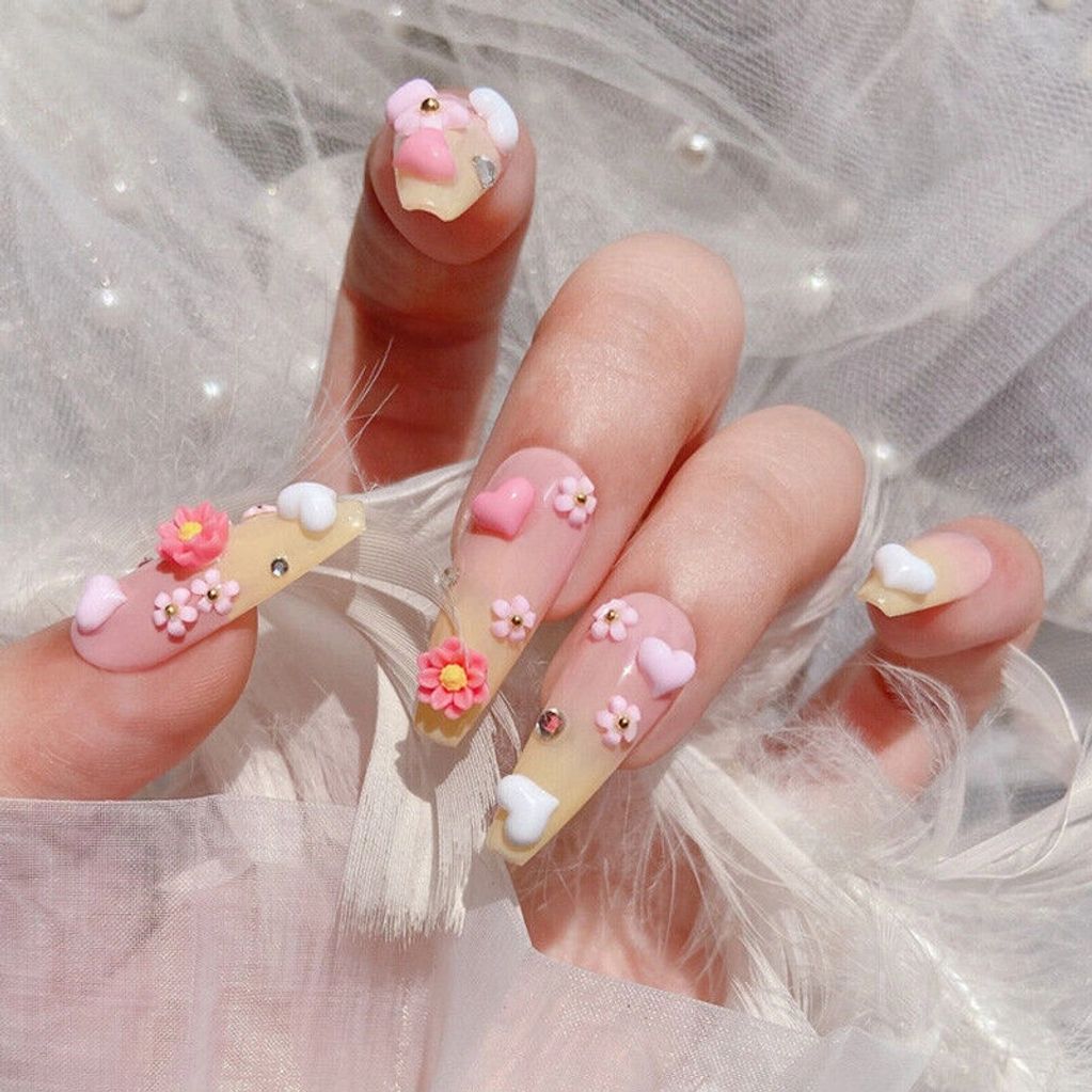 Nail Extension with 3D pink floral and heart decorations.