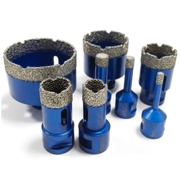 Set of blue diamond drill bits arranged on white surface.