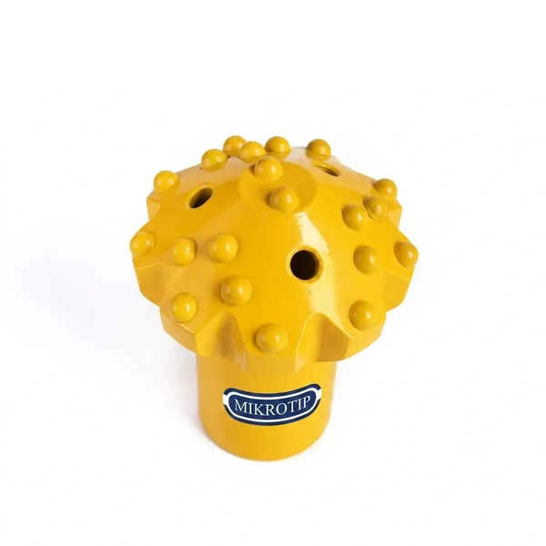 Yellow drill bit with multiple studs and holes labeled MIKROTIP.