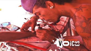 Tattoo artist intensely working on a client's arm in a vibrant setting.