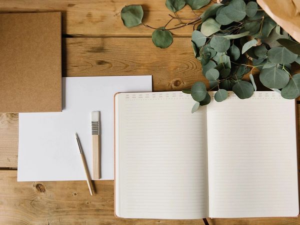 notebooks on a wooden table