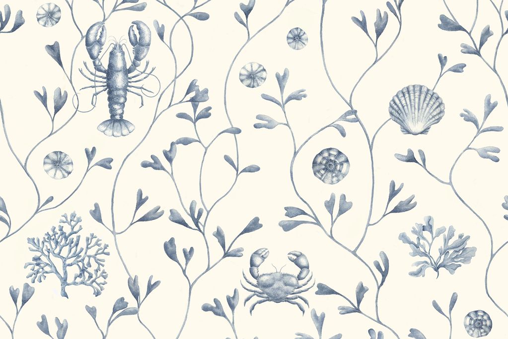 A classic wallpaper in warm indulgent white with contrasting blue brings a timeless look to any room