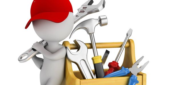 3D figure with a red cap holding a wrench next to a toolbox filled with tools.
