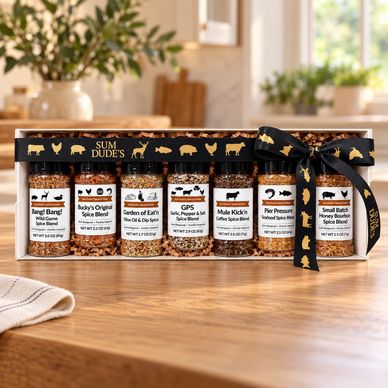 Set of six gourmet spice blends in gift packaging.