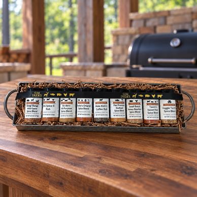 Set of eight spice blends in bottles arranged neatly on a tray.