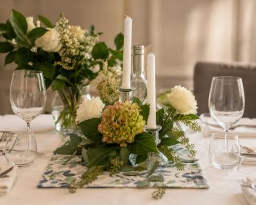 Elegant table setting with flowers and candles.