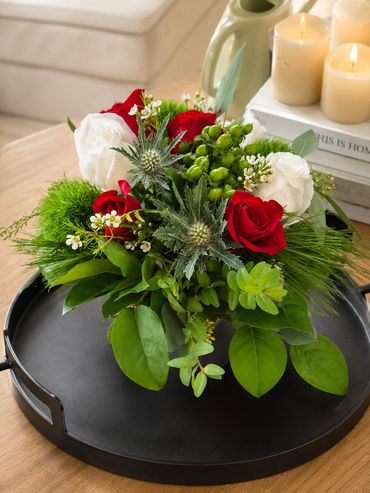 Elegant floral arrangement with red and white roses