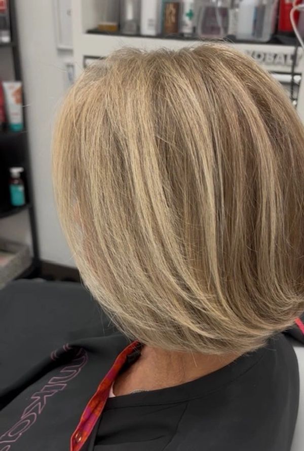 Modern bob haircut medium blonde with highlights