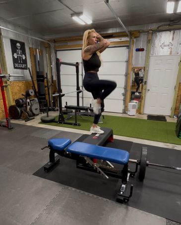 Woman exercising on a bench in a home gym.