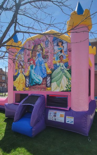 Colorful princess-themed bounce house on a sunny day.
