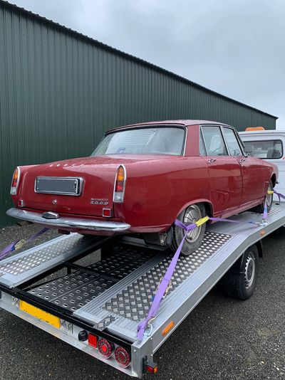 Red Retro Car transporter carries