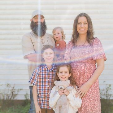 The Irving family standing together outside.