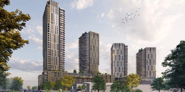 Four modern high-rise buildings in a cityscape.
