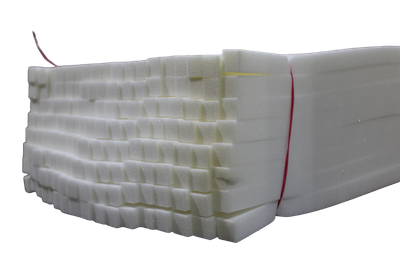 Stack of white foam sheets bound with a rubber band.