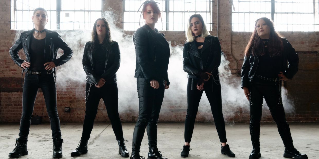 Full band shot of female musicians Nine Inch Heels