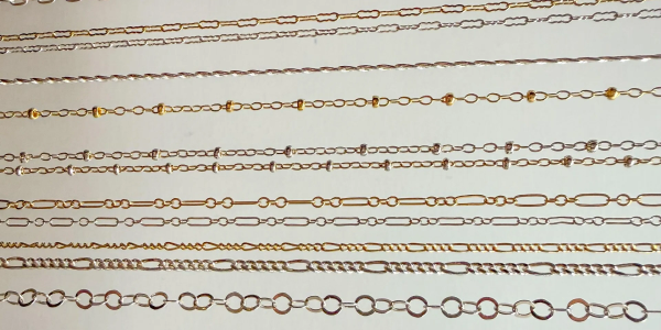 Various gold and silver chains with different link designs.