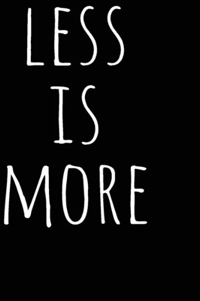 The words 'less is more' in white writing on black background.