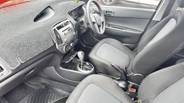 Clean interior of a Hyundai car with fabric seats and automatic gear shift.