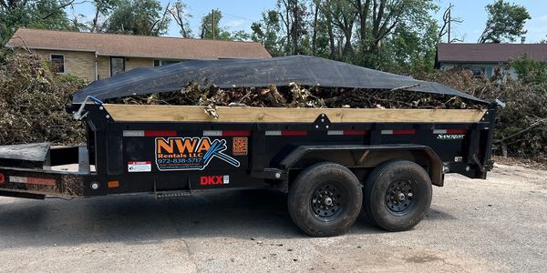 Our14’ dump trailer for rent featuring a roll top tarp cover