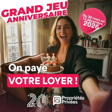 A woman happily presents a birthday cake for a rent-paying contest.