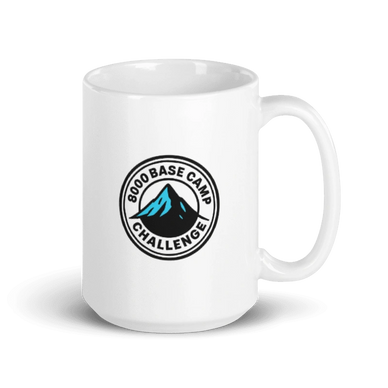 White mug with a mountain logo and "8000 Base Camp Challenge" text.