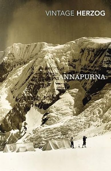 Vintage black and white photo of Annapurna mountain with tents and climbers.