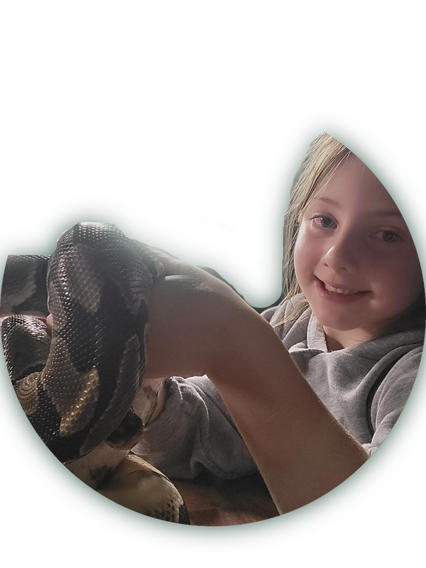 Child smiling during animal handling experience in Stevenston