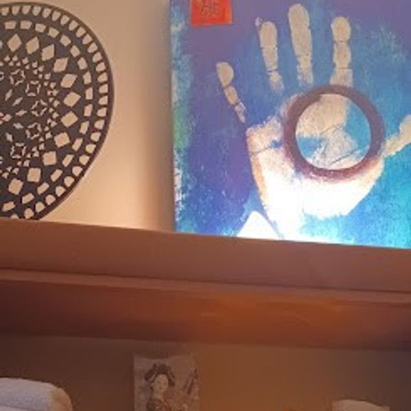 Healing hands painting and mandala sculpture art at Natural Massotherapy in Cleveland, Ohio.